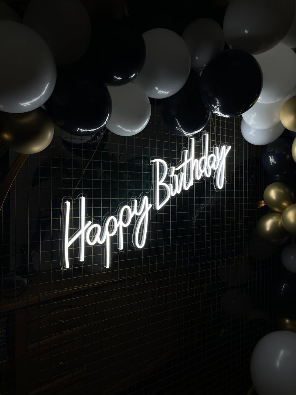 neon sign with balls on wall