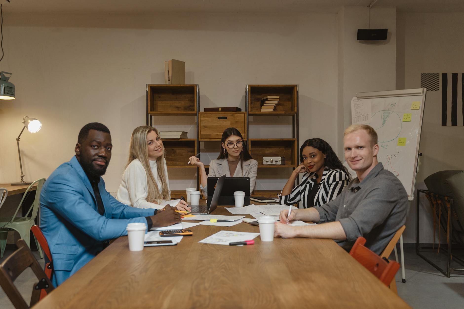 people sitting beside wooden table